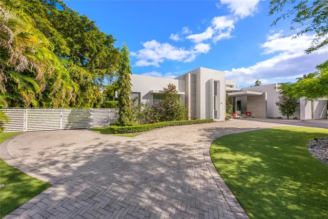 a view of potted plants in front of a building
