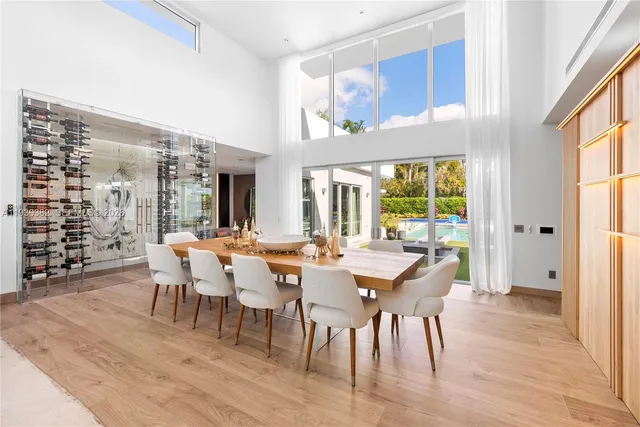 a kitchen with a stove and a wooden floor