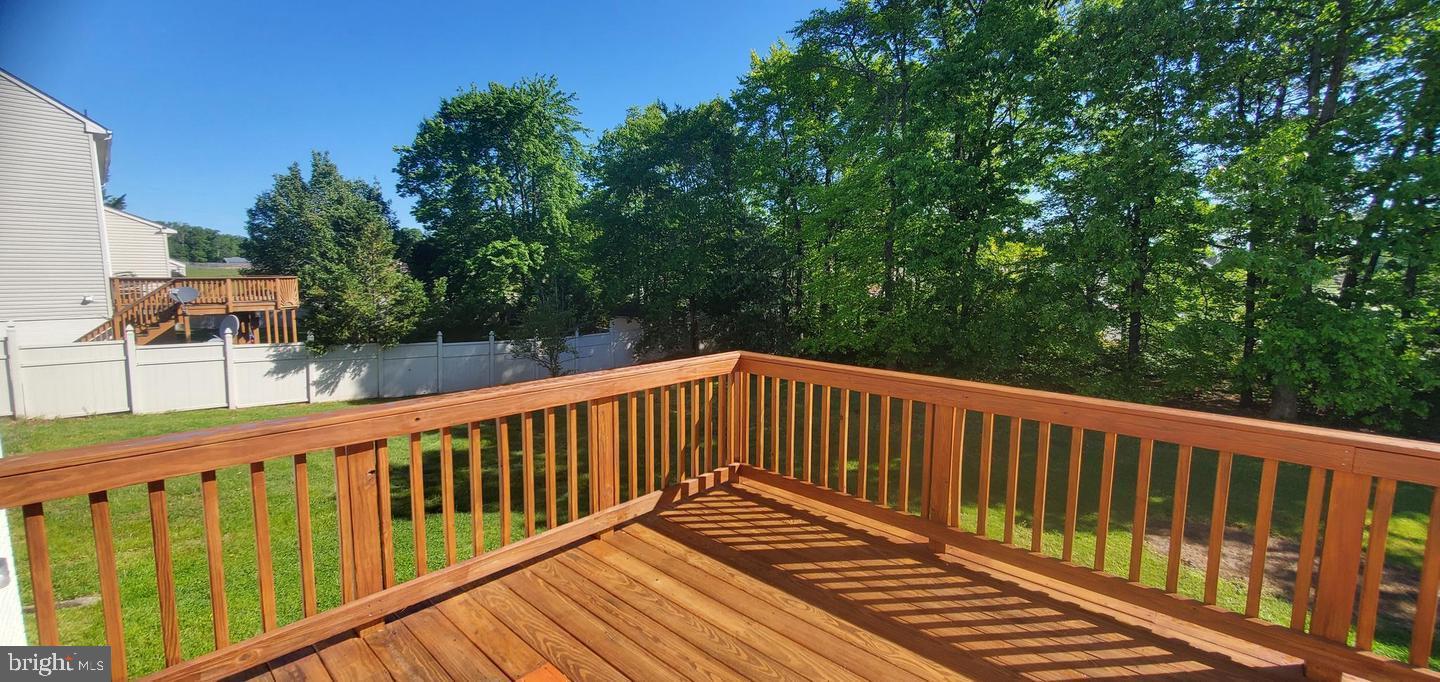 12969 Queen Chapel Road Woodbridge, VA 22193 - Photo 12 of 15 a view of balcony with wooden floor and fence