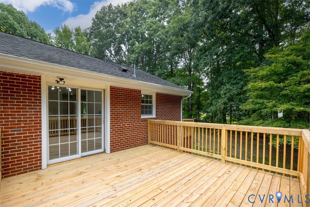 3308 Sylvania Road Chester, VA 23831 - Photo 53 of 55 Expansive wood deck with a natural finish, wood ra