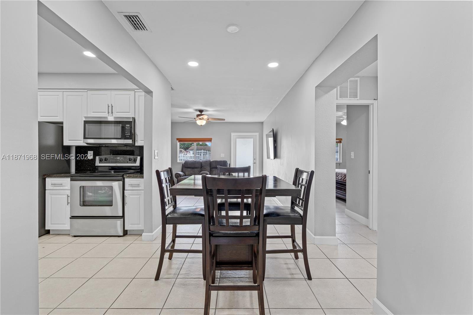 11740 Southwest 182nd Terrace Miami, FL 33177 - Photo 11 of 44 a view of a dining room with furniture