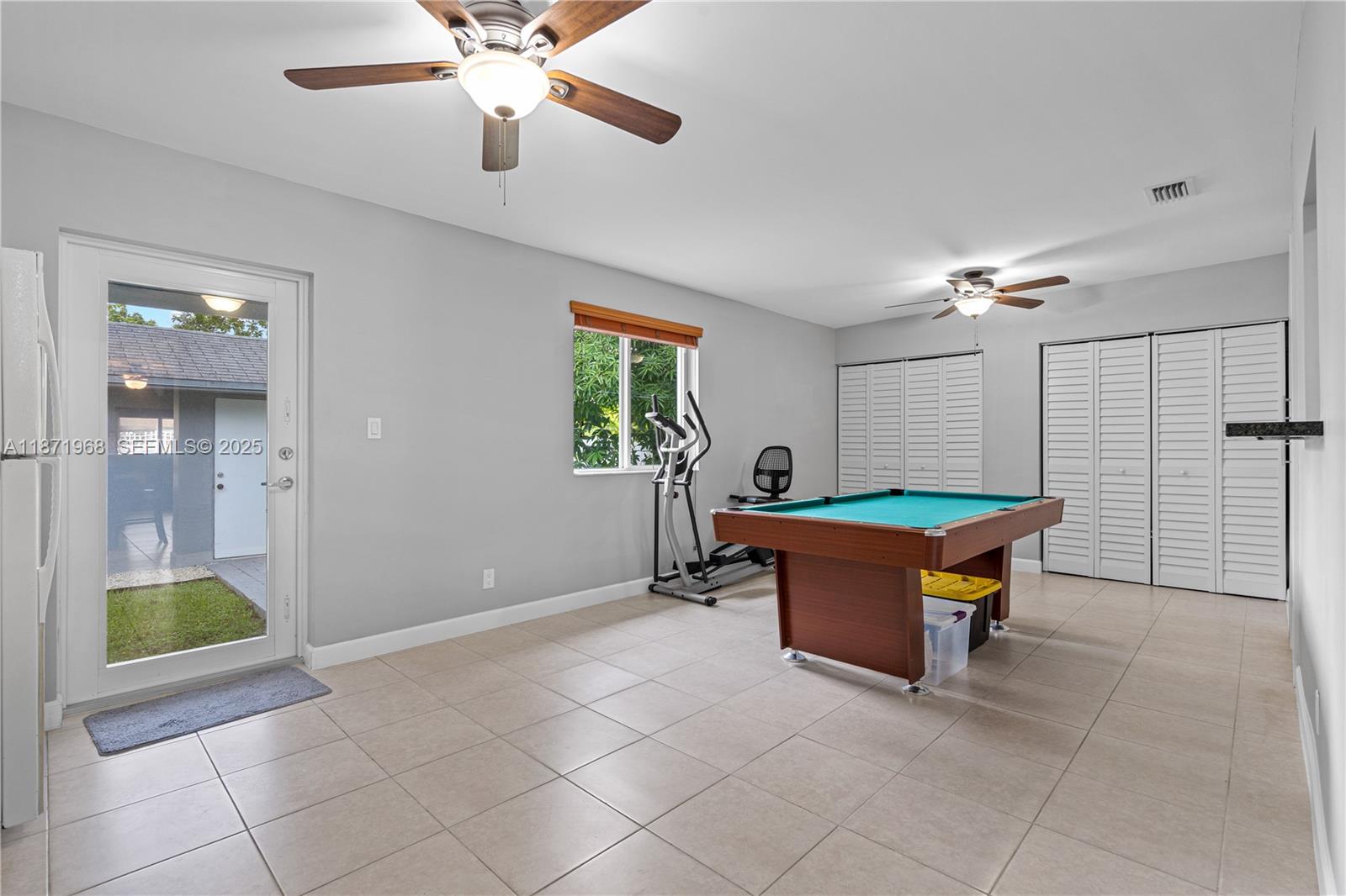 11740 Southwest 182nd Terrace Miami, FL 33177 - Photo 15 of 44 a room with pool table and windows