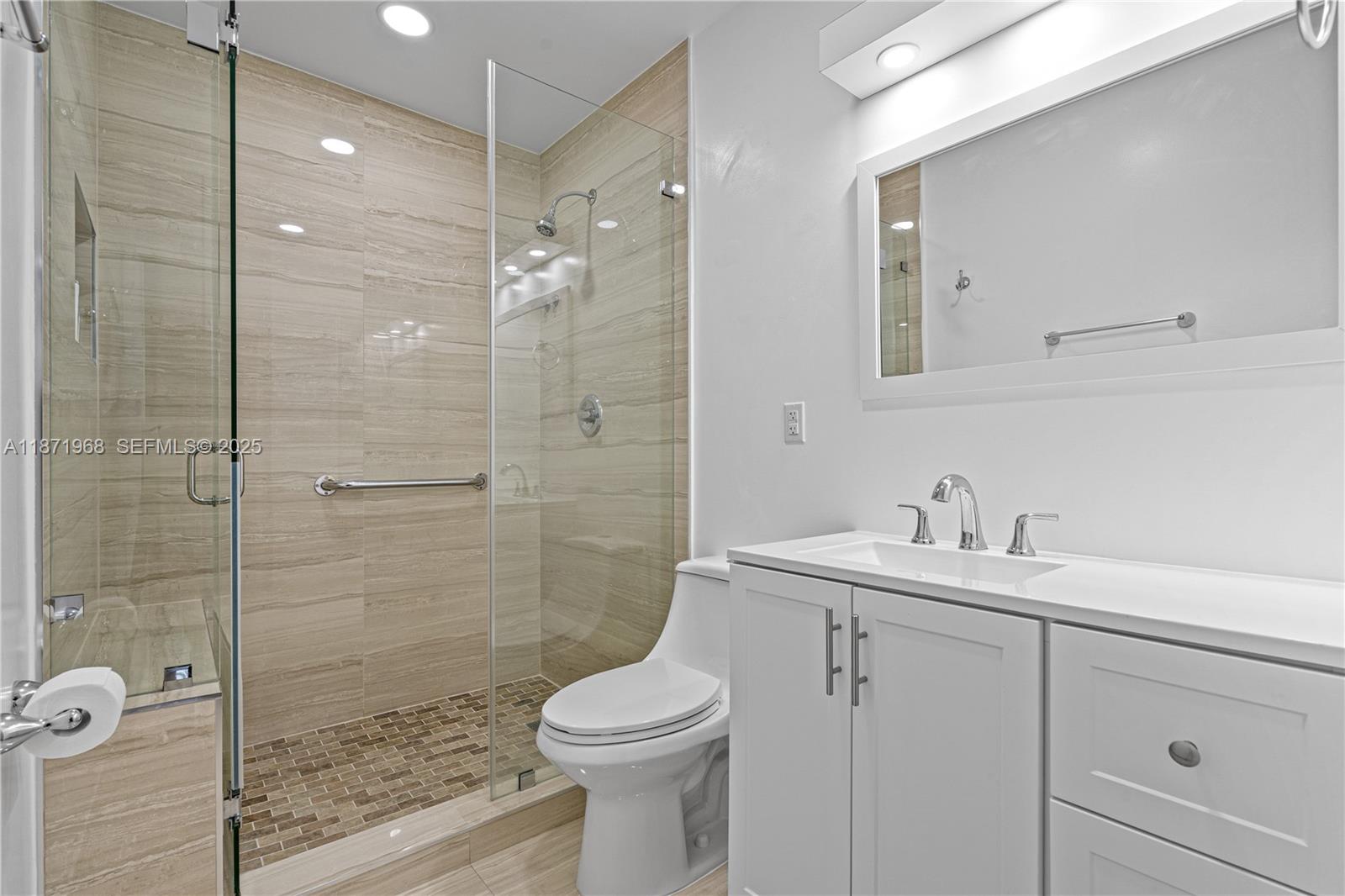 11740 Southwest 182nd Terrace Miami, FL 33177 - Photo 22 of 44 a bathroom with a sink a toilet and shower