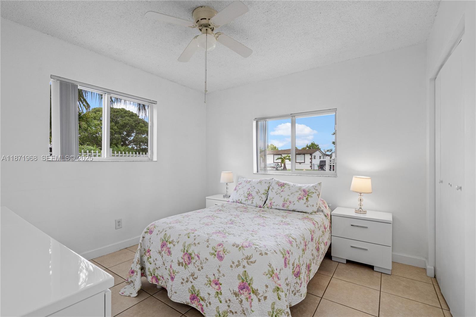 11740 Southwest 182nd Terrace Miami, FL 33177 - Photo 34 of 44 a bedroom with a bed and a window