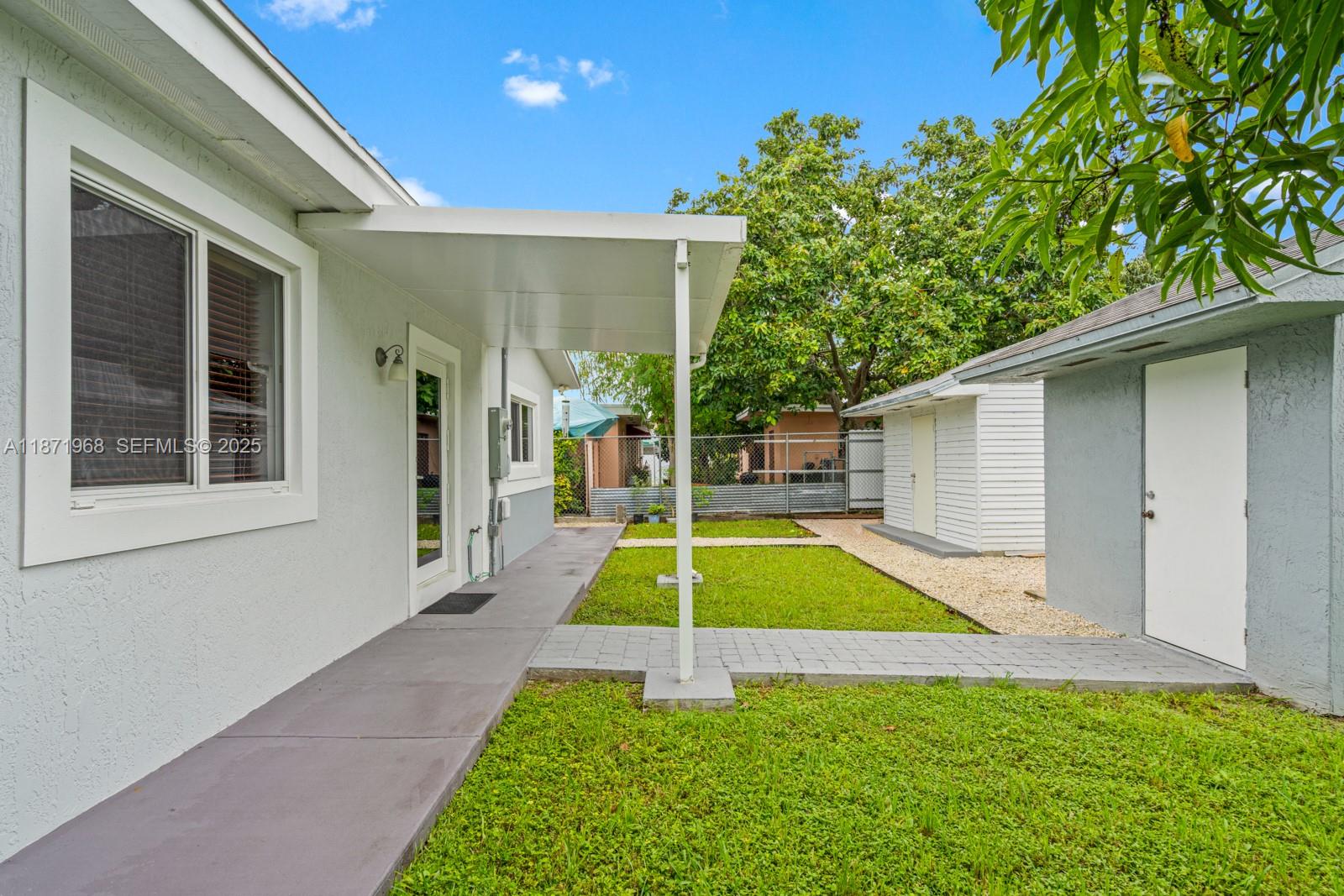 11740 Southwest 182nd Terrace Miami, FL 33177 - Photo 40 of 44 a house view with a backyard space