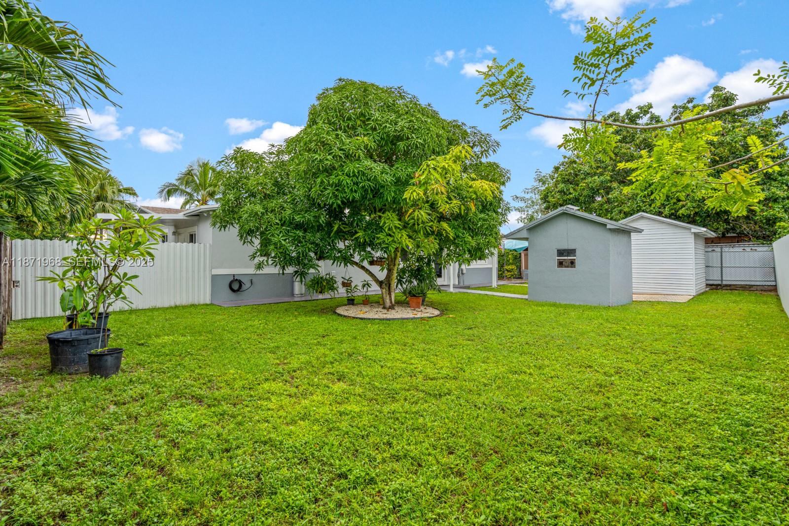 11740 Southwest 182nd Terrace Miami, FL 33177 - Photo 43 of 44 a house view with a garden