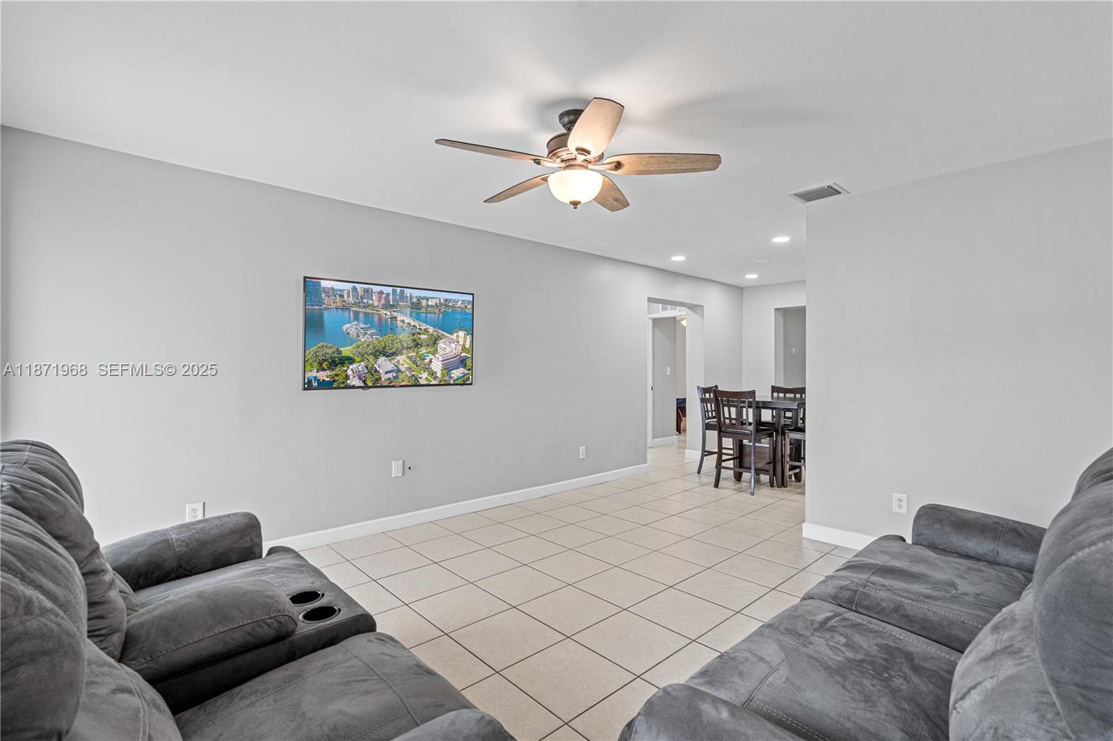 11740 Southwest 182nd Terrace Miami, FL 33177 - Photo 9 of 44 a bedroom with furniture and a chandelier