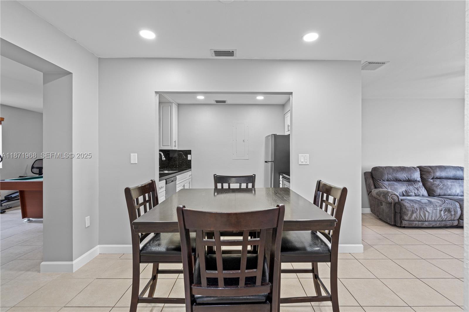 11740 Southwest 182nd Terrace Miami, FL 33177 - Photo 10 of 44 a view of a dining room with furniture