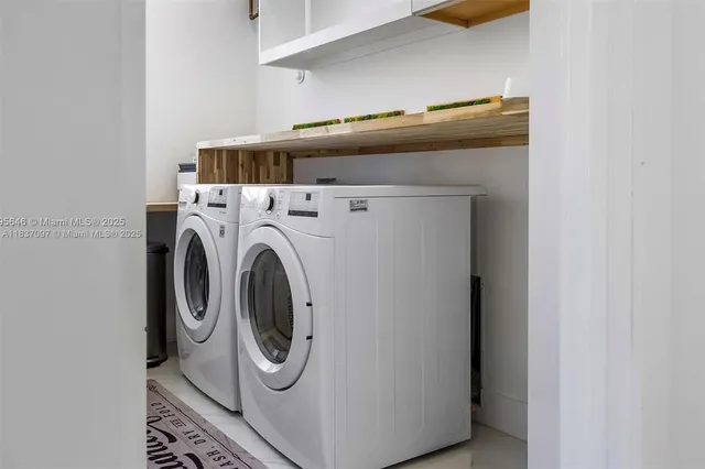 a view of balcony with two chairs and a table