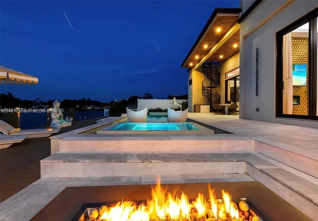 a view of a chairs and table in a patio
