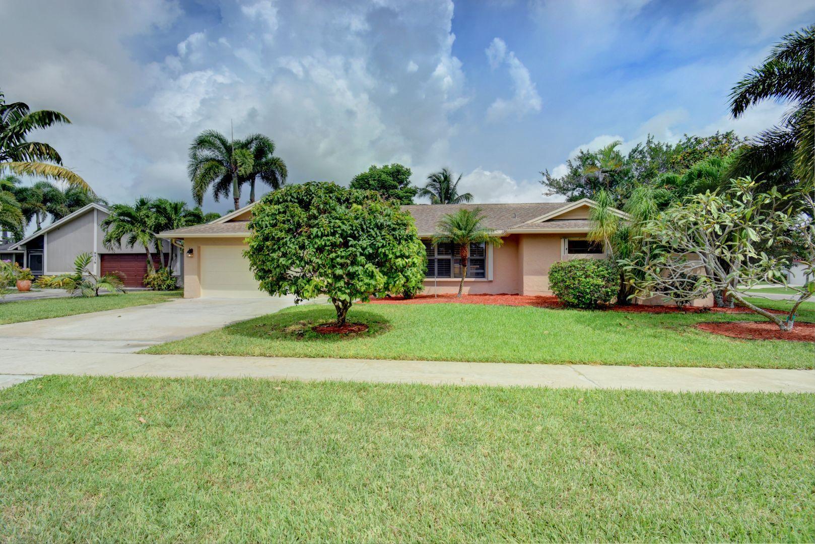 9525 Denver Court Boca Raton, FL 33434 - Photo 1 of 26 a house view with a garden space