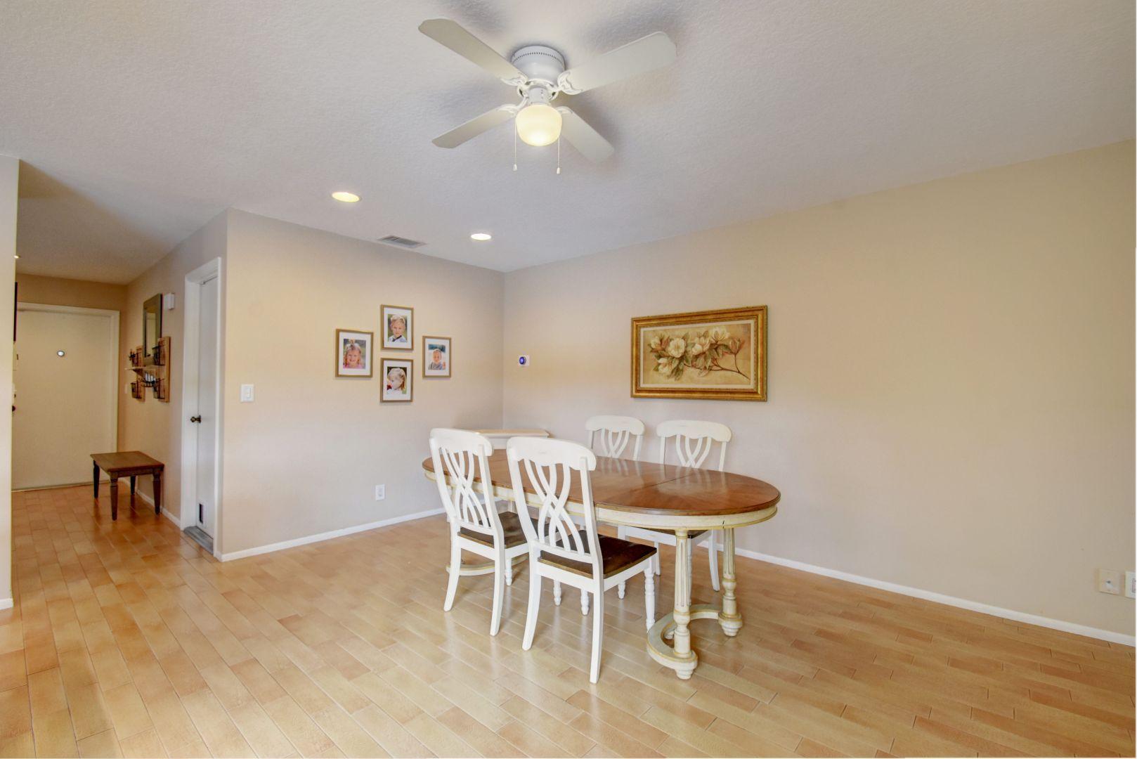 9525 Denver Court Boca Raton, FL 33434 - Photo 12 of 26 a view of a dining room with furniture and a chandelier fan