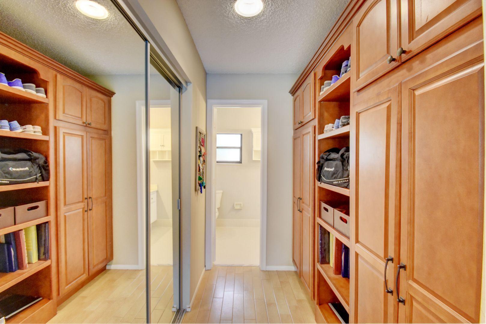 9525 Denver Court Boca Raton, FL 33434 - Photo 16 of 26 a view of front door with wooden floor and a cabinet