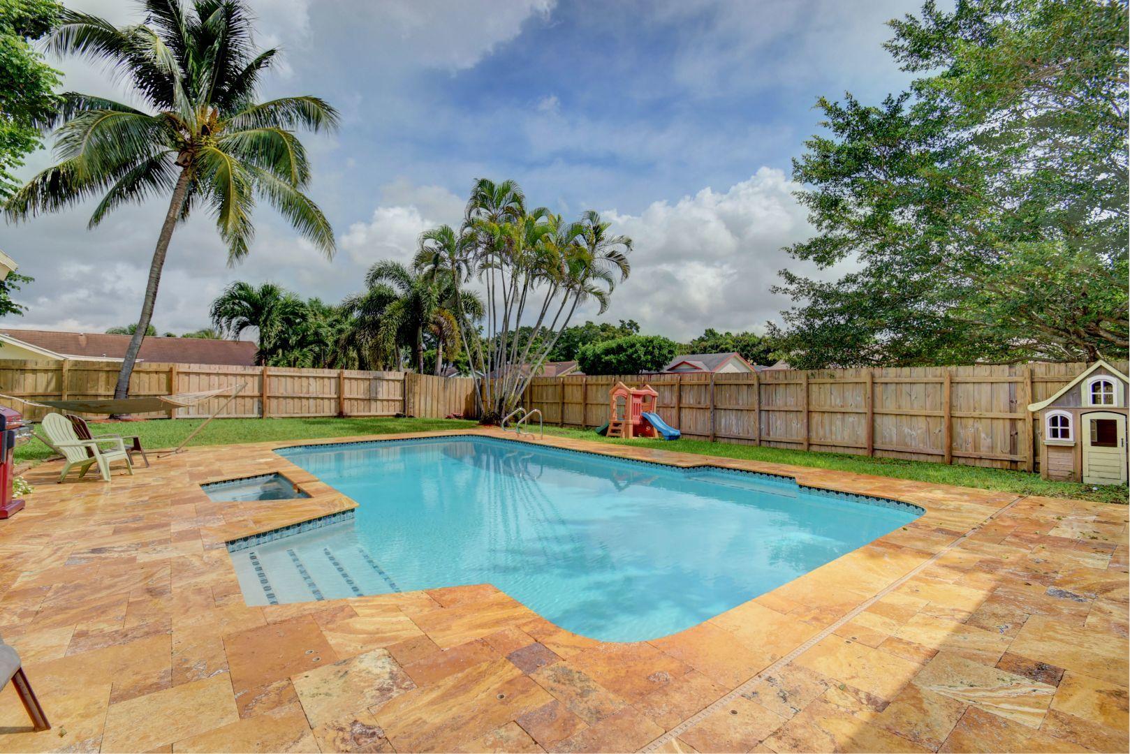 9525 Denver Court Boca Raton, FL 33434 - Photo 22 of 26 a view of swimming pool with lounge chair