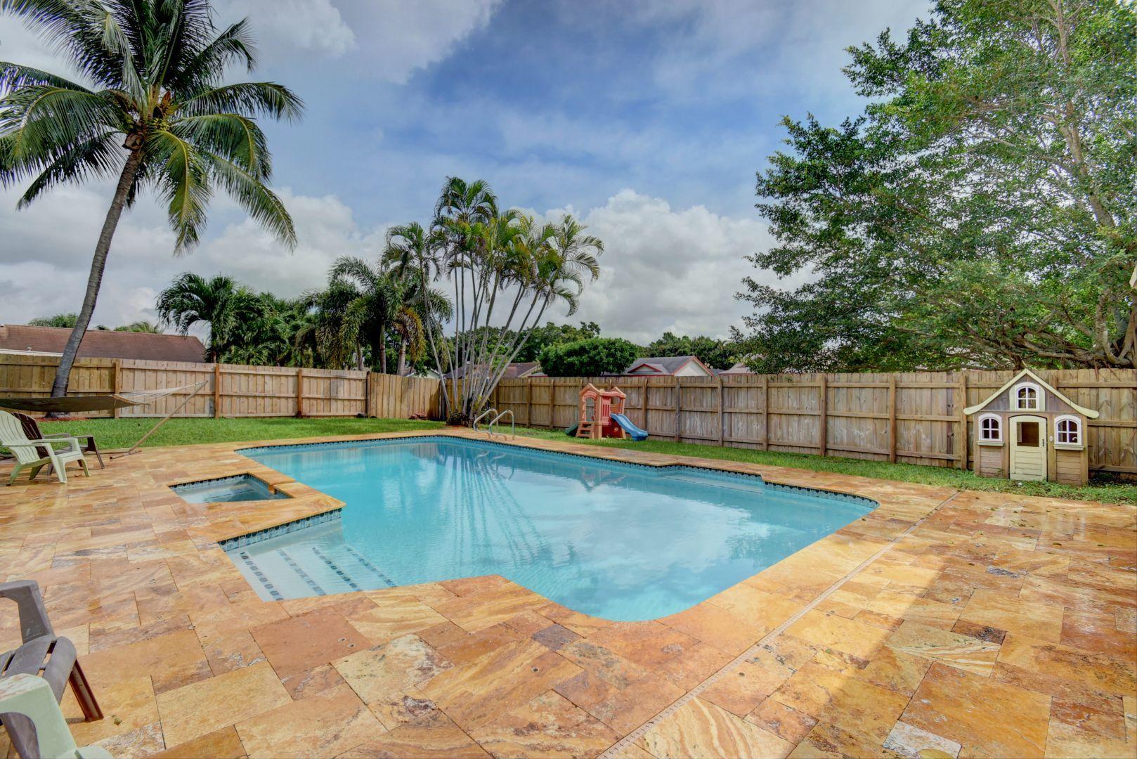 9525 Denver Court Boca Raton, FL 33434 - Photo 26 of 26 a view of swimming pool with lounge chair