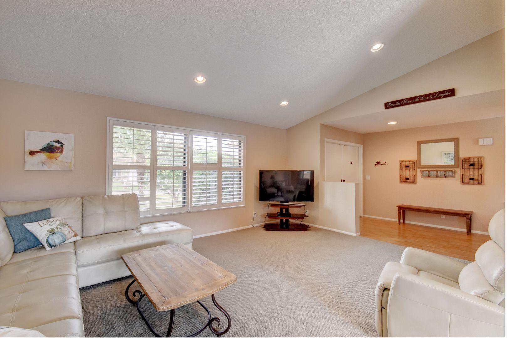 9525 Denver Court Boca Raton, FL 33434 - Photo 4 of 26 a living room with furniture and a flat screen tv