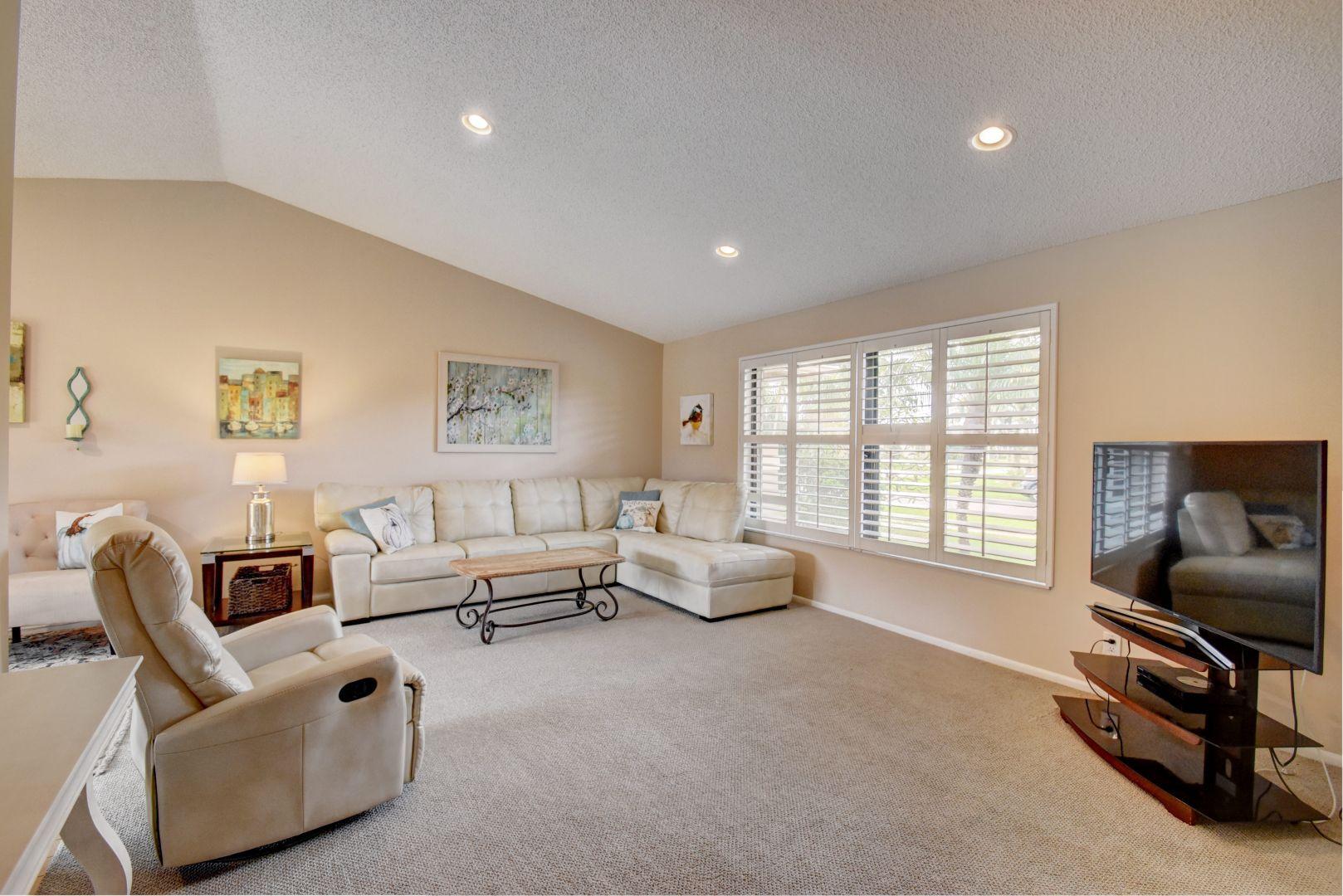 9525 Denver Court Boca Raton, FL 33434 - Photo 5 of 26 a living room with furniture and a flat screen tv