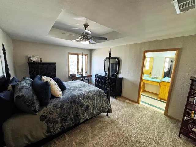 a bed room with a bed and a tv