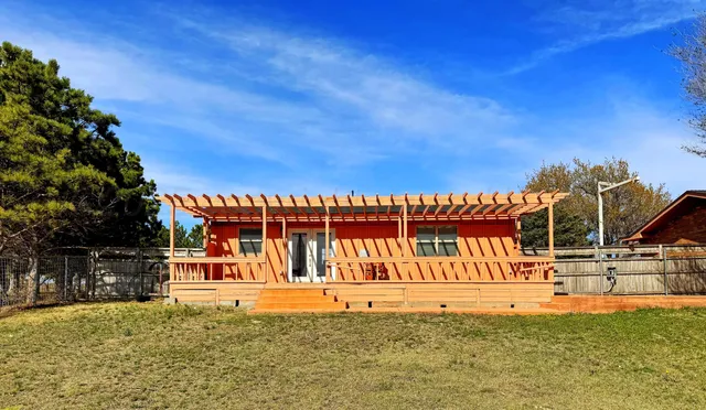 a view of swimming pool with an outdoor seating
