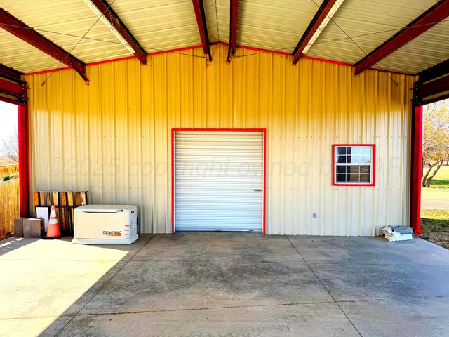 a view of an empty room with a large window