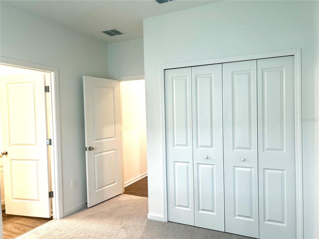 1103 Northwest 44th Court Road Ocala, FL 34482 - Photo 16 of 36 a view of a closet area with en suite bathroom