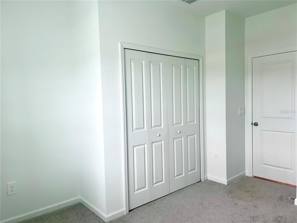 1103 Northwest 44th Court Road Ocala, FL 34482 - Photo 21 of 36 an empty room with windows