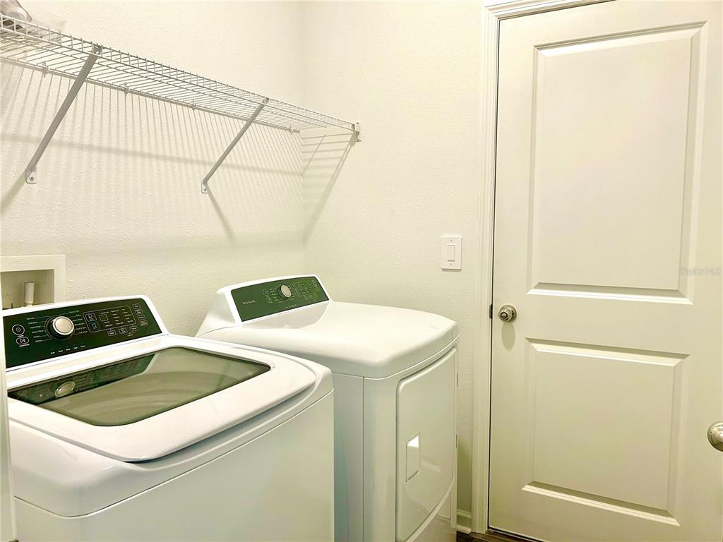 1103 Northwest 44th Court Road Ocala, FL 34482 - Photo 22 of 36 a utility room with dryer and washer