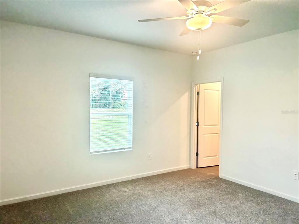 1103 Northwest 44th Court Road Ocala, FL 34482 - Photo 23 of 36 an empty room with a window