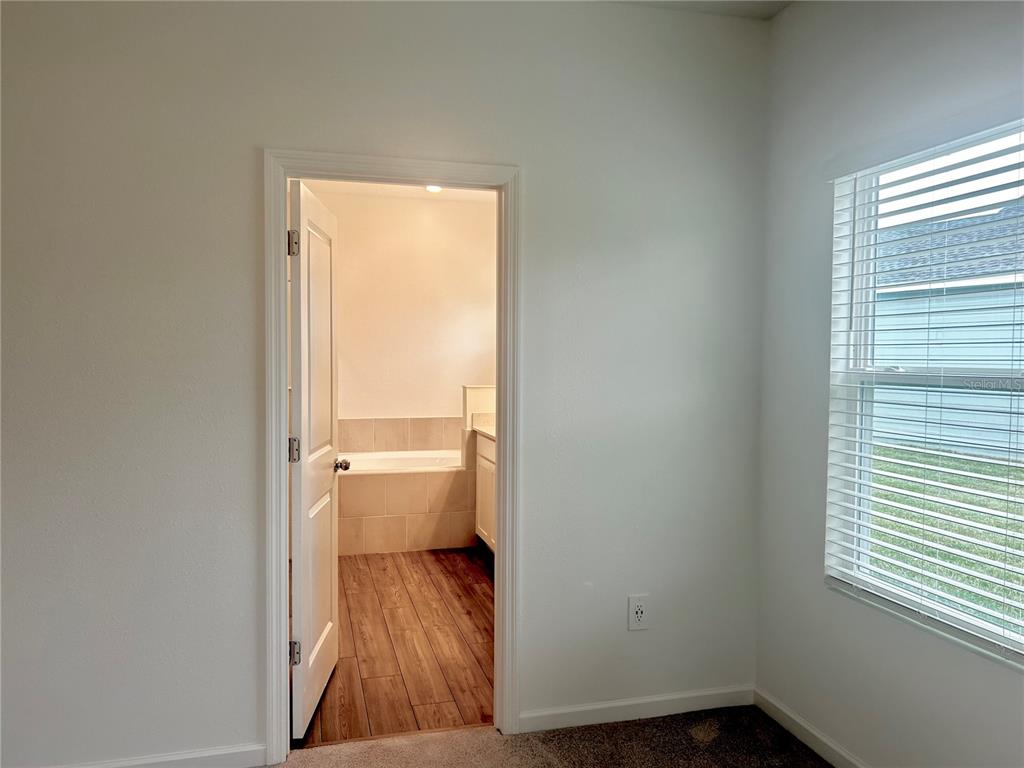 1103 Northwest 44th Court Road Ocala, FL 34482 - Photo 26 of 36 a bathroom with a sink and a toilet