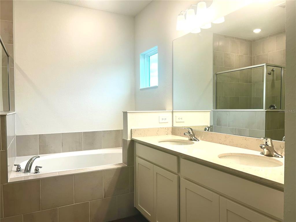 1103 Northwest 44th Court Road Ocala, FL 34482 - Photo 27 of 36 a bathroom with a bathtub and a sink