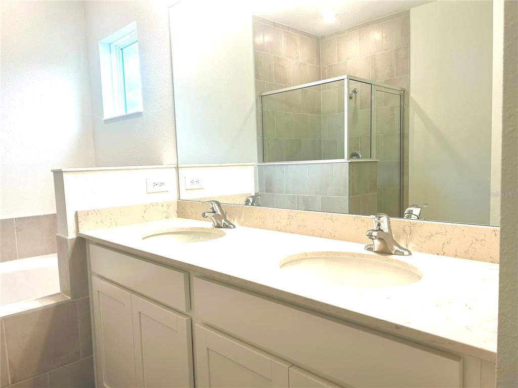1103 Northwest 44th Court Road Ocala, FL 34482 - Photo 30 of 36 a bathroom with a sink and a mirror