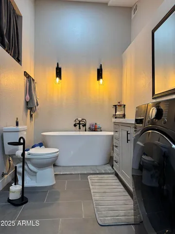 a bathroom with a sink a toilet and a bathtub