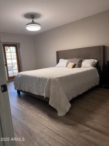 a bedroom with a bed and a table