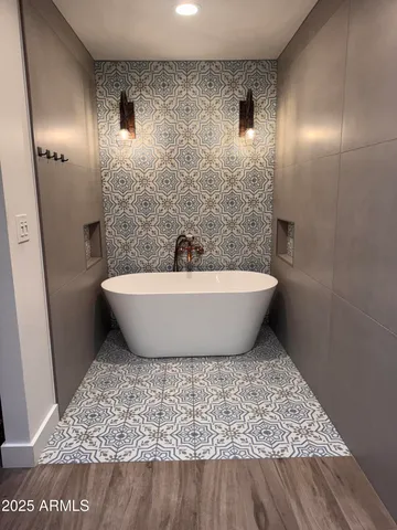 a bathroom with a bathtub and shower