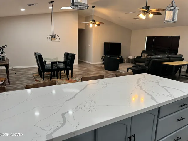 a kitchen with stainless steel appliances a microwave a stove and refrigerator