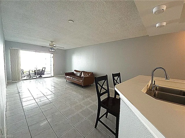 a lobby with furniture and rug