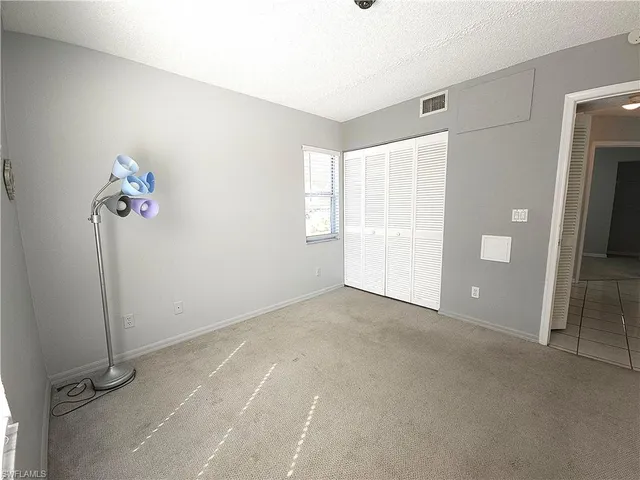 a view of empty room with windows