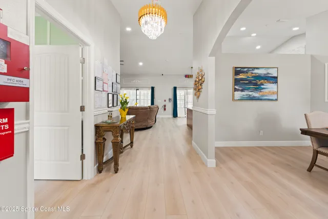 a view of kitchen with furniture and a refrigerator