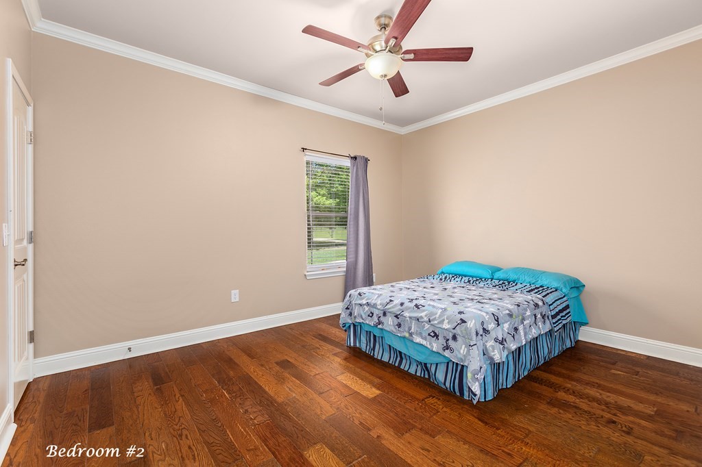 1171 Old Ewing Road Lufkin, TX 75901 - Photo 24 of 49 a bedroom with a bed and a window