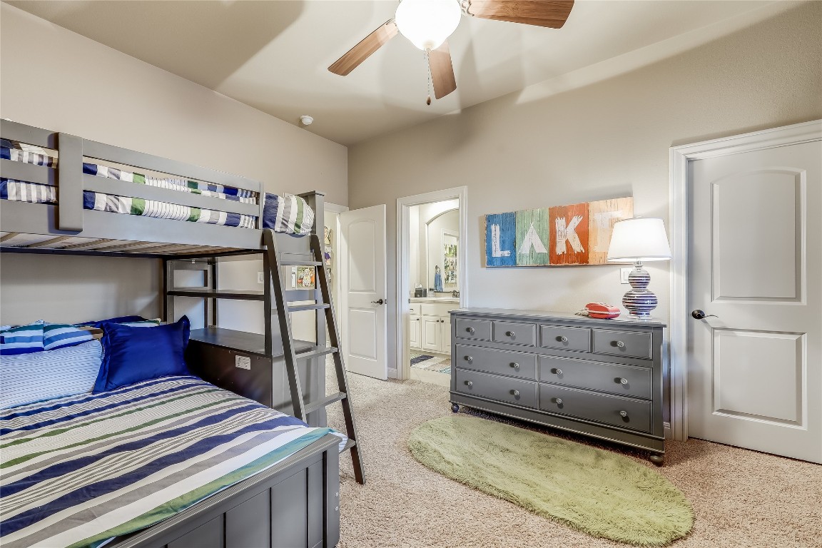 17704 Regatta View Drive Jonestown, TX 78645 - Photo 24 of 38 a room with a bed and furniture