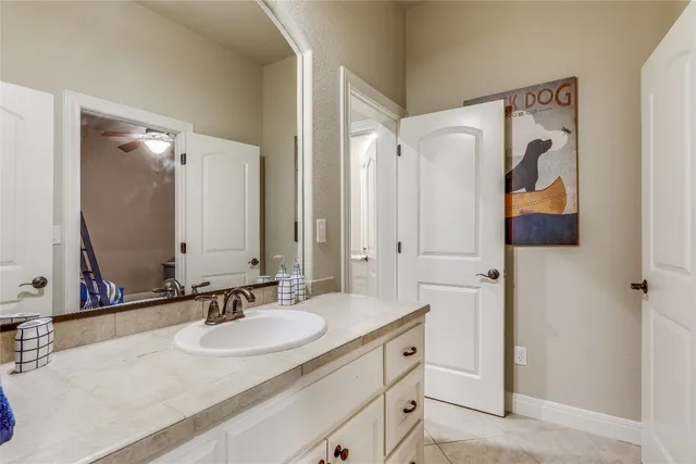 a bathroom with a double vanity sink mirror and double
