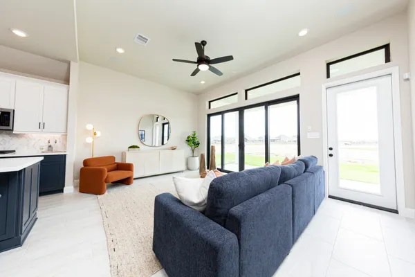 a living room with furniture and a large window