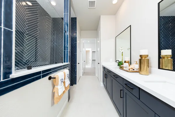 a bathroom with a double vanity sink and mirror