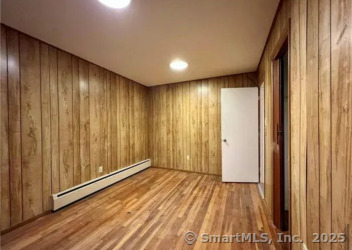 958 Dunbar Hill Road Hamden, CT 06514 - Photo 12 of 22 a view of a hallway with wooden floor