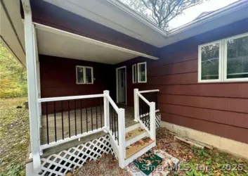 a front view of a house with stairs