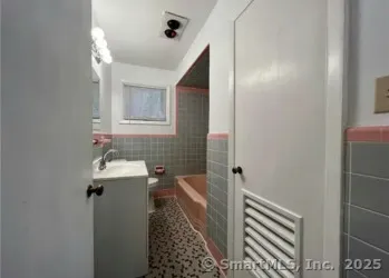 a bathroom with a sink and mirror