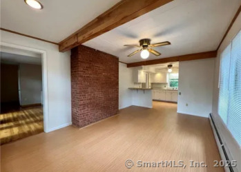 958 Dunbar Hill Road Hamden, CT 06514 - Photo 4 of 22 a view of an empty room and a window