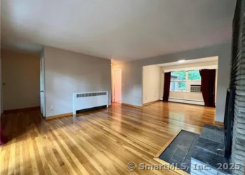 958 Dunbar Hill Road Hamden, CT 06514 - Photo 9 of 22 a view of an empty room with a window and wooden floor