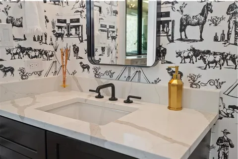 a bathroom with a sink and a mirror