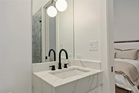 a bathroom with a sink and a mirror